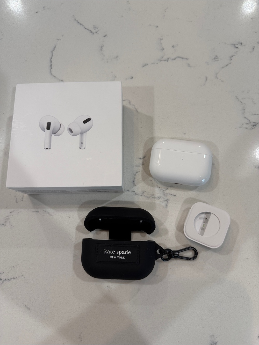 Apple AirPods Pro with MagSafe Charging Case + Kate Spade Black Silicone Case